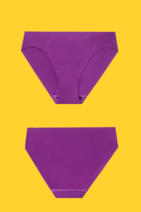 pair of purple period underwear on a yellow background